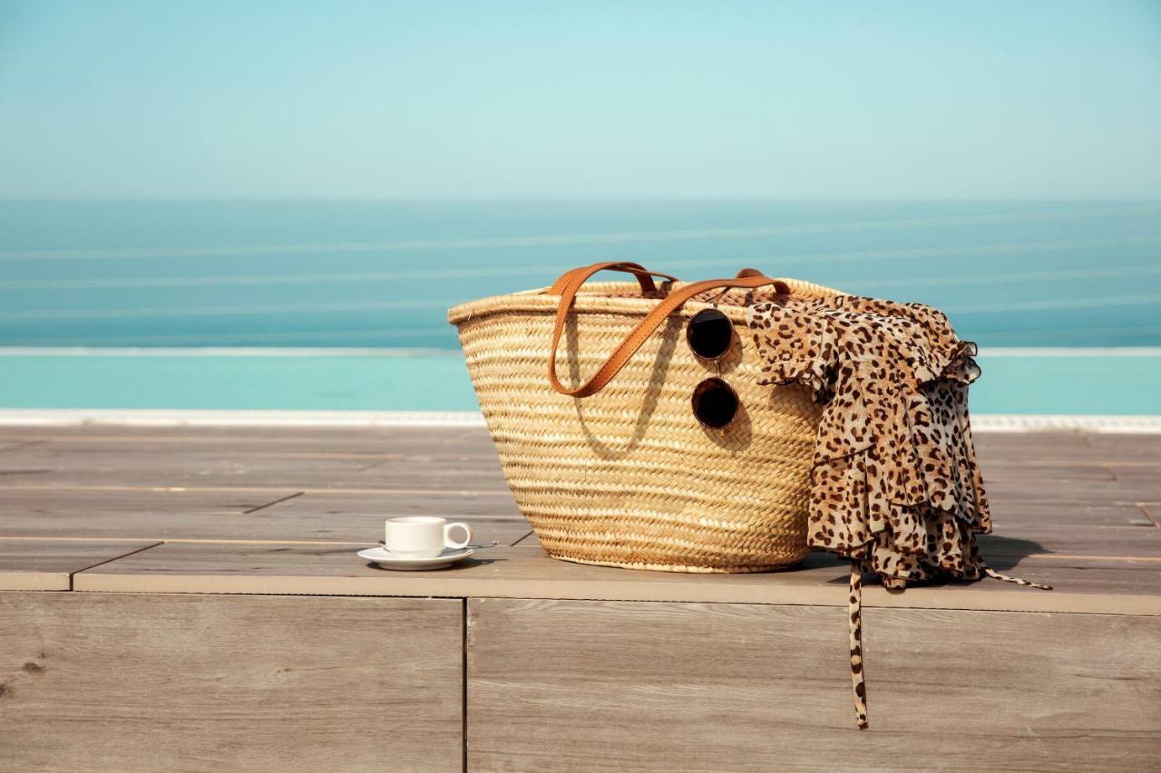 Toscana Charme Resort Tirrenia Eksteriør billede A straw beach bag